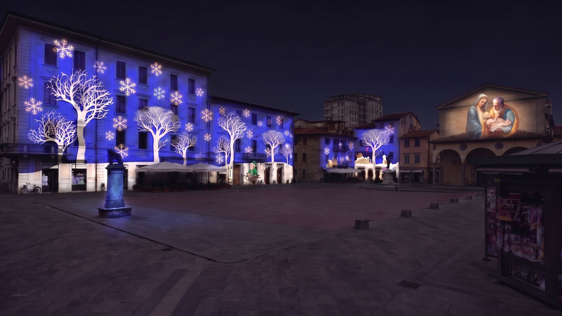 La stessa piazza con proiezioni natalizie mappate sulle facciate e tappeto di luce a terra