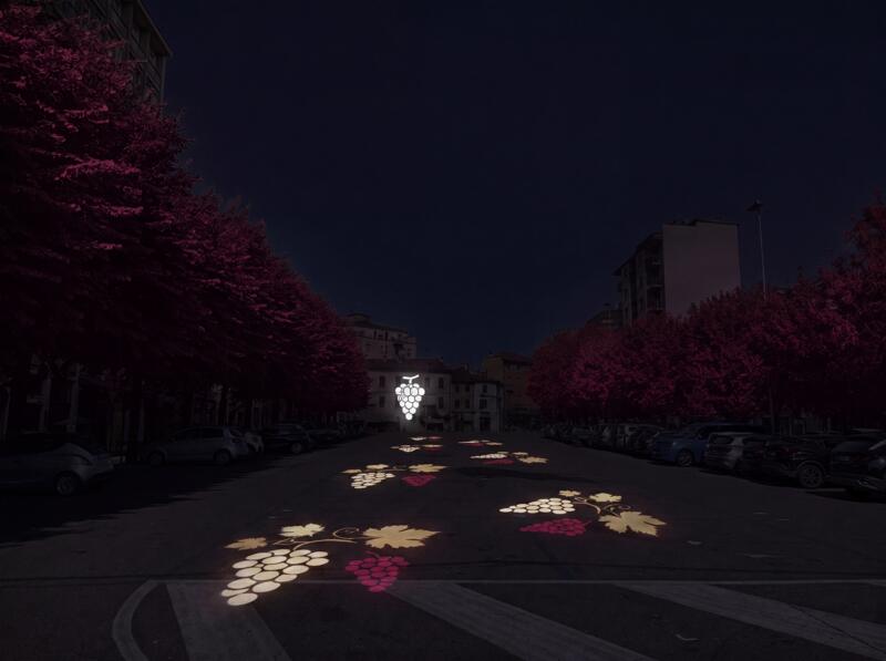 Via alberata con fondale luminoso e tappeto di luce a terra